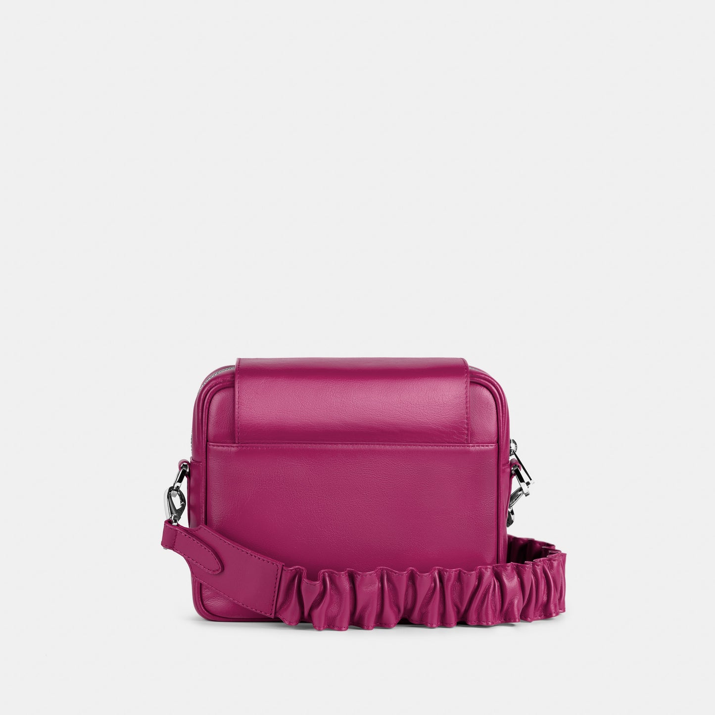 Bandolera pequeña en piel de vacuno en color fucsia para mujer