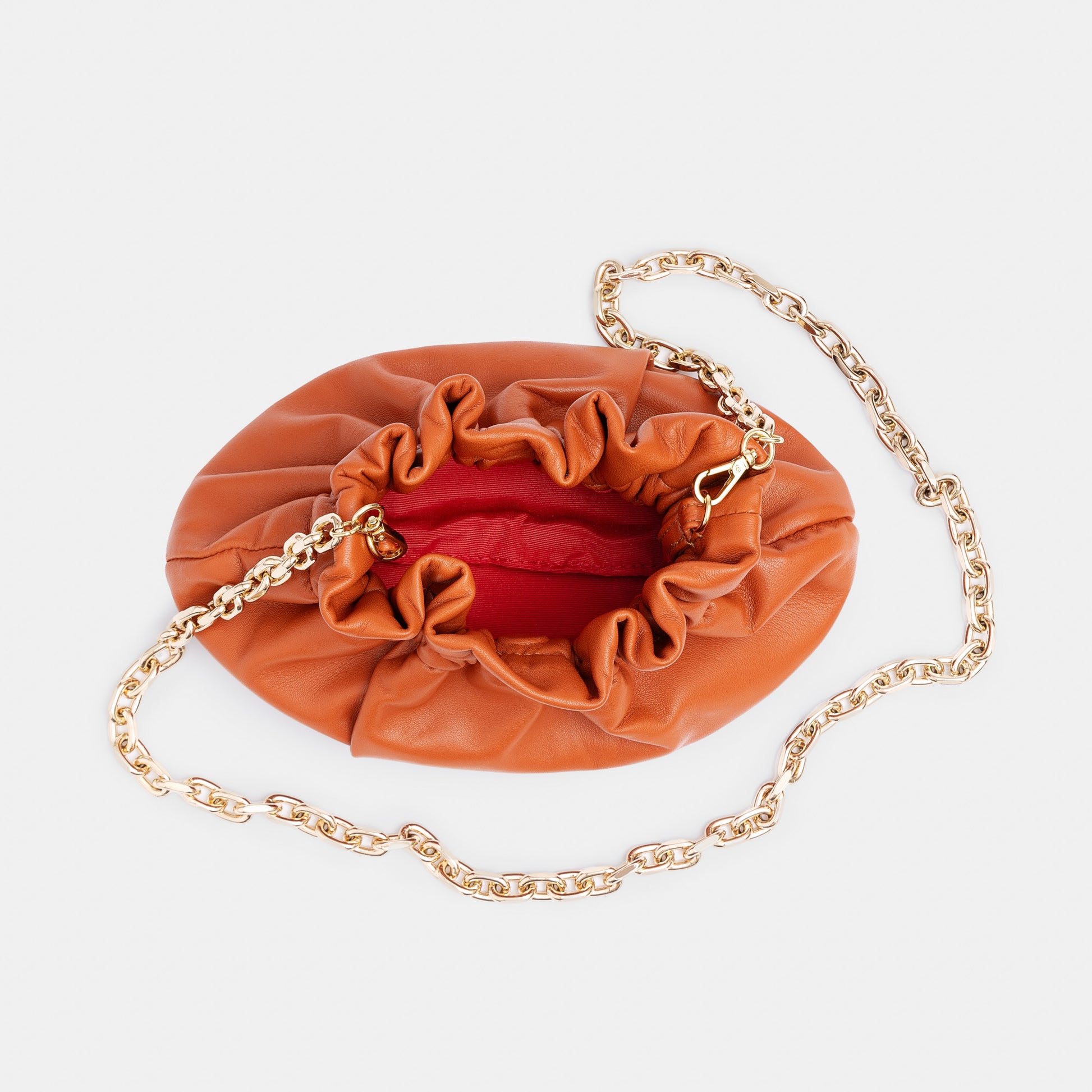 Minibolso pequeño en piel de cordero  en color naranja para mujer