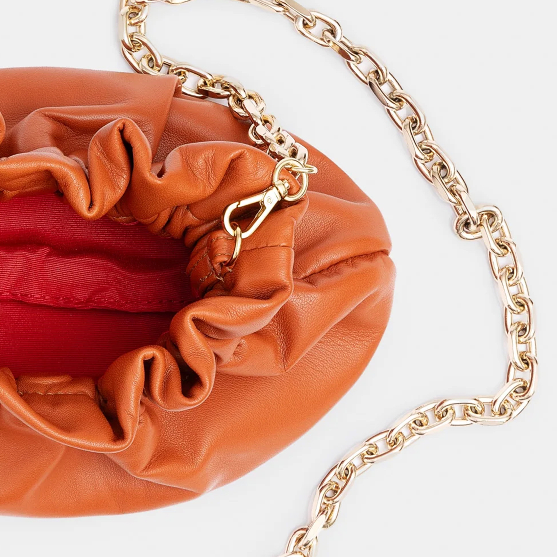Minibolso pequeño en piel de cordero  en color naranja para mujer