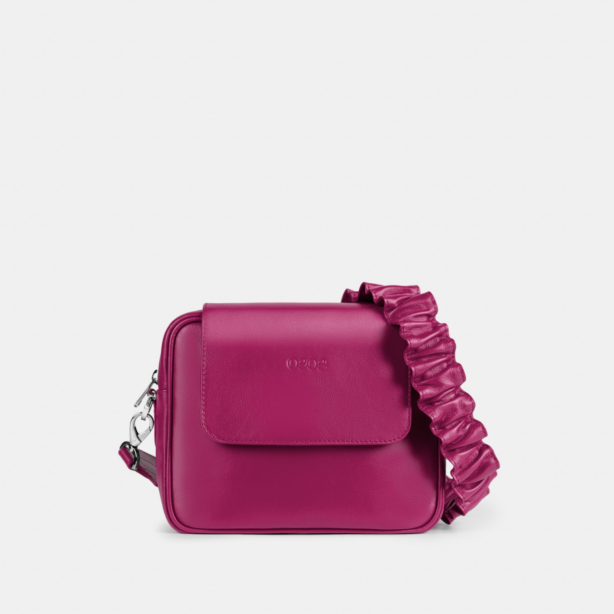 Bandolera pequeña en piel de vacuno en color fucsia para mujer