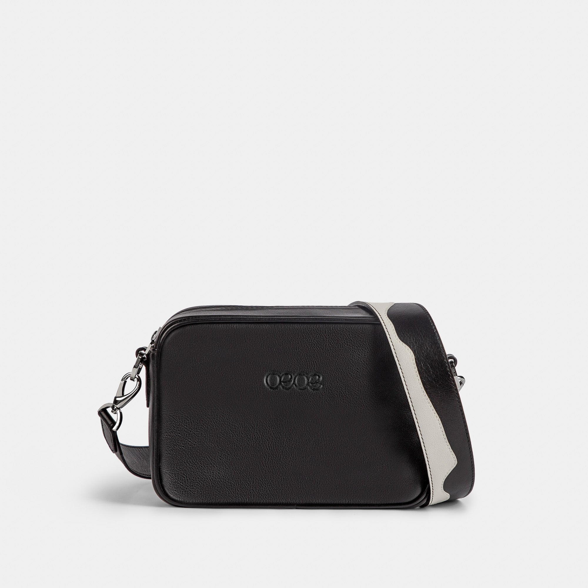Bandolera pequeña en piel de vacuno en color negro/blanco para mujer