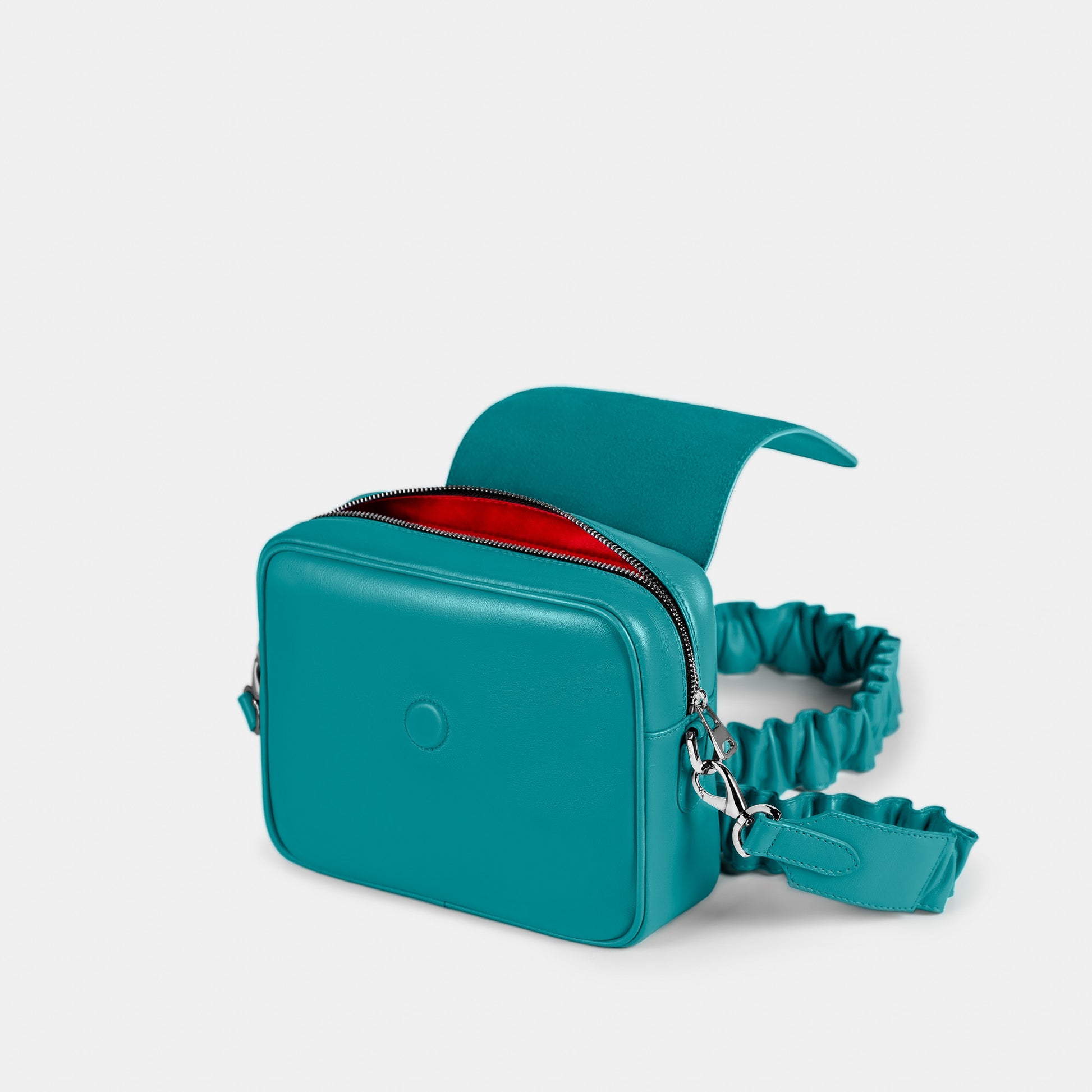 Bandolera pequeña en piel de vacuno en color turquesa para mujer