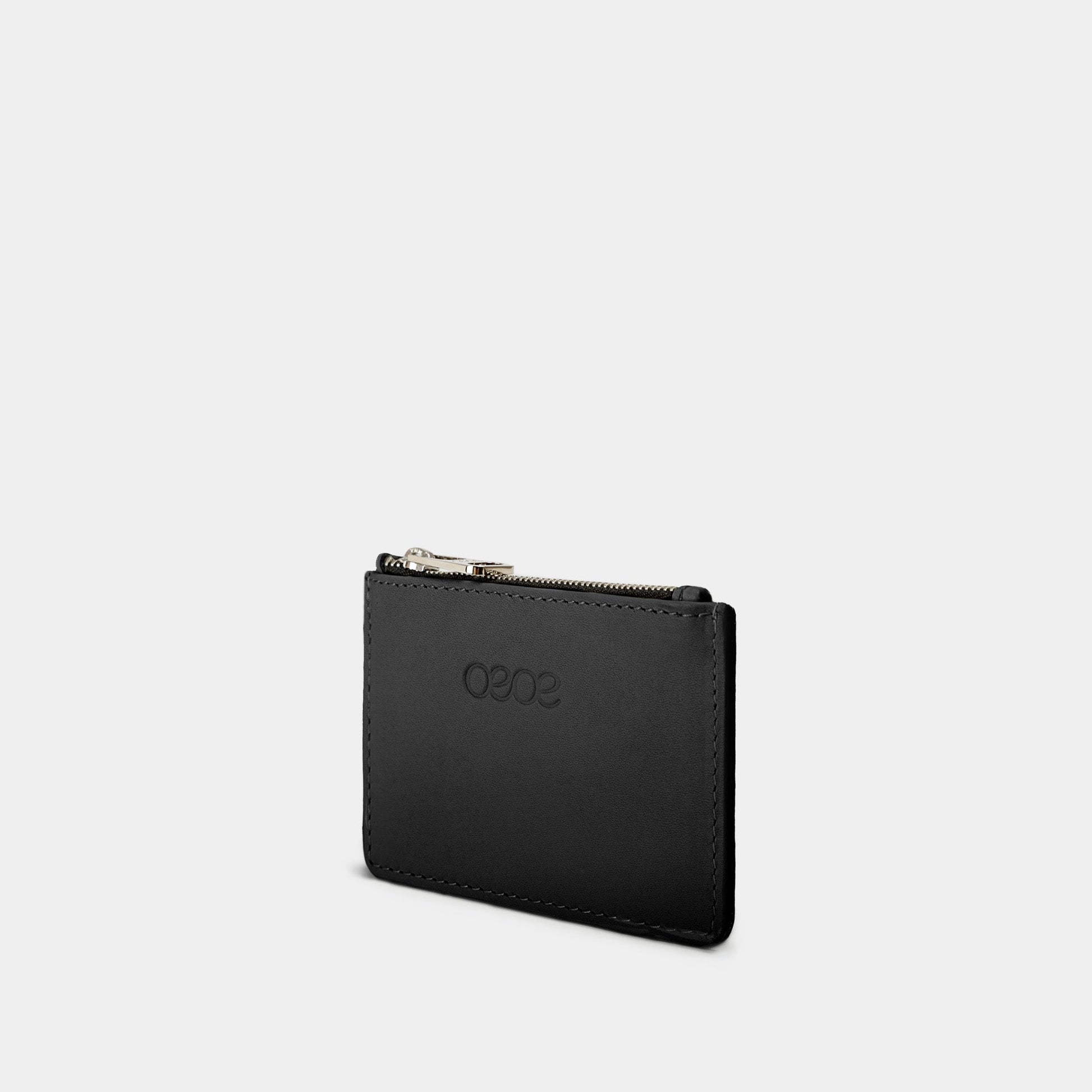Cartera pequeña en piel de vacuno en color negro para mujer